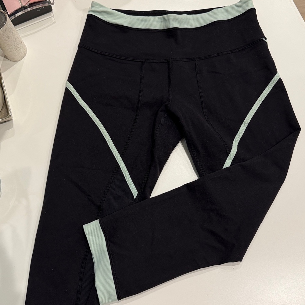 Lululemon Size 6 Black Leggings with Mint Trim
